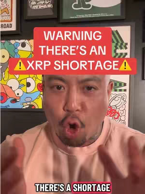 The cover image is a selfie-style shot featuring a man in the foreground with a red and yellow banner warning of an XRP shortage. The man is positioned centrally and appears to be speaking, with an open mouth. The background has framed artwork and a dark wall.