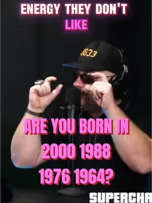 A man wearing a black cap and sunglasses is shown from the chest up. The cap has the number 1633 on it. He's holding his fingers together as if pinching something small, and text overlays are on the image. The background is dark.