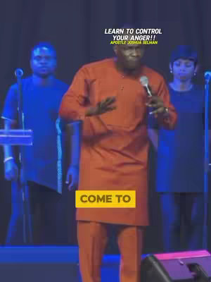 The cover image shows a man in an orange outfit speaking into a microphone on a stage. There are two other people in the background. Text overlays at the top and bottom.