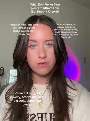 A selfie-style shot featuring a young woman in front of a soft, diffused background with a subtle purple/pink lighting effect. She's positioned with her head and shoulders visible and has brown hair cascading around her face. Text overlays provide information about how different Venus signs express their style.