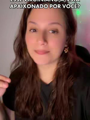 A woman with long brown hair and a black top is the central focus. Text overlays the image. The background is slightly out of focus, with hints of light and blurred shapes.
