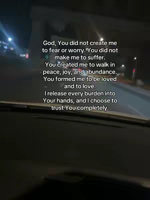 The image shows a view from inside a car driving at night. The windshield is visible in the foreground, and the road and buildings are blurred in the background. Overlaid on the image is a block of white text containing an inspirational message.