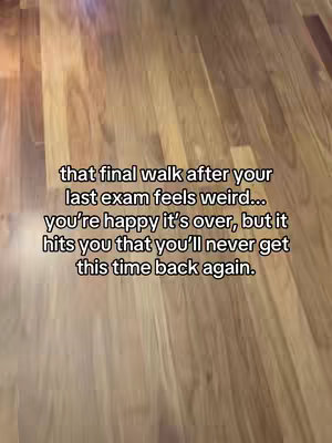 The image shows a close-up view of wooden flooring. Overlaid on the wood is text in a white font. The text discusses the feeling of the 'final walk' after taking an exam, mixing joy and nostalgia.