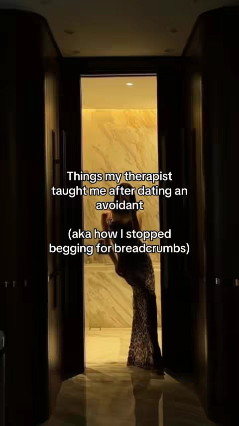 The cover image shows a woman partially visible through an open doorway, set in a bright, reflective interior setting. She is wearing a long, patterned dress. Overlayed text provides the video's hook.