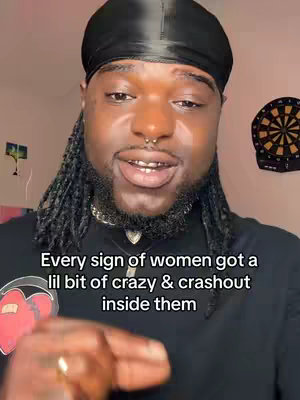 The image features a Black man wearing a black durag, a silver chain, and a nose ring, talking to the camera. The text overlay on the image says, "Every sign of women got a lil bit of crazy & crashout inside them." The background colors are muted with a dart board on the right side.