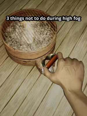 The image shows a top-down view of a partially assembled grill with a hand holding a grilling tool. A round, metallic grill is in the center, appearing used with ash residue inside. A hand with light skin tone is positioned on the right, holding a grilling tool that has a brown handle and silver metallic parts. The background is wooden flooring with a light brown, warm color scheme which suggests an outdoor or patio setting.