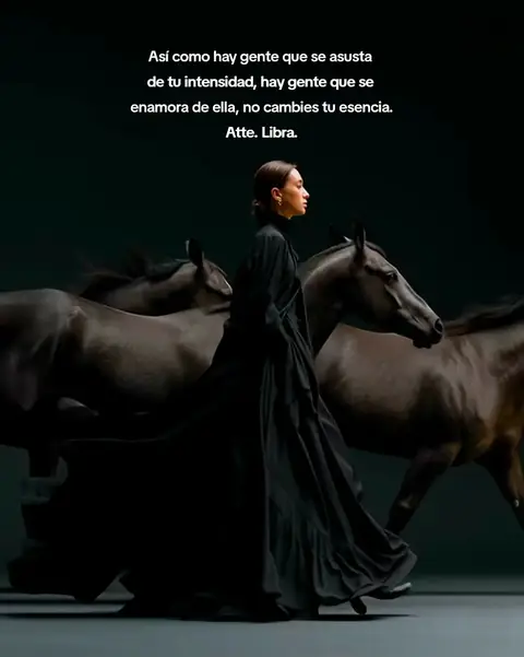 A woman in a long, flowing black dress walks past several dark horses, which are in motion. Text is overlaid on the image.
