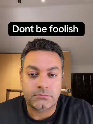 A selfie-style shot featuring a man with short, dark hair and a neutral expression. He is positioned against a blurred background, and a black rectangle across the top of the frame displays white text.