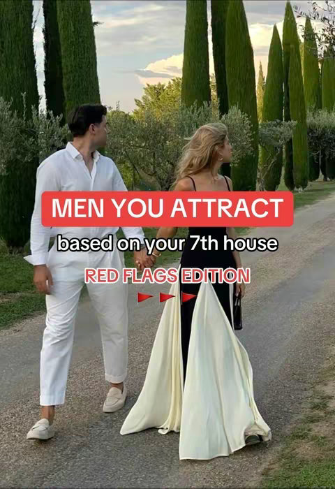 A cover image shows a couple walking on a pathway, hands clasped. The man on the left is wearing a white shirt and pants, while the woman on the right wears a black dress with an off-white long skirt that drapes to the ground. A red banner with white text appears in the middle, with red flag symbols at the bottom. Tall, green trees line the background.