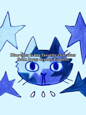 The cover image is a digitally drawn artwork set against a light blue background. The central figure is a blue cat with round blue eyes and pointed ears, stylized in a simple, cartoonish manner. Surrounding the cat are five blue stars of varying sizes. Below the cat, there are three teardrop shapes. Text overlayed on the image reads, 'Blue tiger is her favorite character from kpop demon hunters'. The overall composition is balanced, with the cat as the focal point, and the blue color scheme providing a cohesive visual theme.