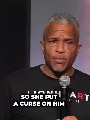 The cover image shows a middle-aged Black man with gray hair and a serious expression. He is wearing a black t-shirt, a microphone is held in front of him. Text overlayed on the video says, "SO SHE PUT A CURSE ON HIM".