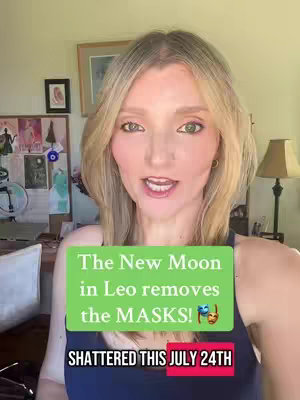 A woman with light blonde hair is centered in a video frame, looking directly at the camera and speaking. A green rectangular overlay with white text is placed mid-frame, partially covering her chest. The overlay text suggests a astrological prediction. Below the green box, a smaller, red rectangular box states a date. The background features a room with framed pictures and a wooden wall.