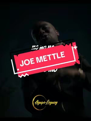 A man is featured in a dark, moody shot. Overlaid on top is a red rectangular label with the text "JOE METTLE", with additional text above and below, and the logo for "Agape Legacy" positioned in the lower-left corner.