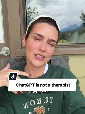 A woman is shown in a selfie-style video. She wears a white headband and a green sweatshirt. Text overlayed reads \"ChatGPT is not a therapist\". The background shows a window with mountains.