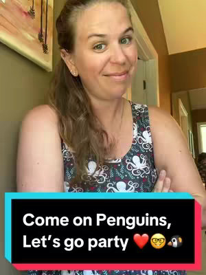 A woman with long, light-brown hair, stands in front of a light-colored wall with an abstract painting on the left. She is wearing a sleeveless top with a pattern. In the bottom center is a graphic with text that reads, "Come on Penguins, Let's go party" with emojis.