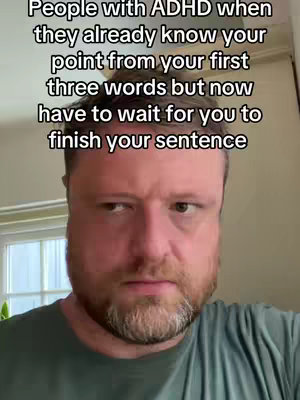 A close-up shot of a man with a neutral expression, looking slightly off to the side. Text overlays are present at the top of the image.