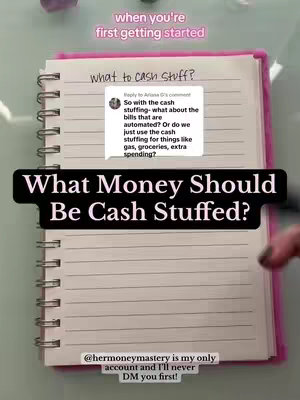 The image is a close-up of a notebook with a pink cover, lying on a light-colored surface. It is open to a double-page spread with lines. Text is overlayed on the image explaining the title topic. The top of the left page has the question "what to cash stuff?" written on it. A comment from an online user is included in the image explaining the context of the cash stuffing process.