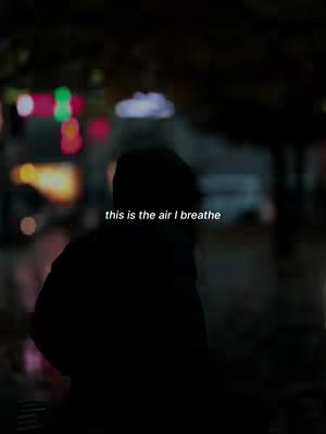 A silhouette of a person standing with their back to the camera in an urban setting at night. The background is blurred with colorful lights, suggesting a city or street at dusk. The text has been added to the image.