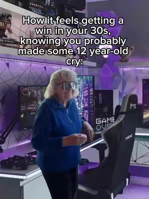 An elderly woman wearing oversized sunglasses stands in a gaming room, smiling and leaning on a gaming chair. Text overlays describe the scene as the feeling of winning in your 30s, knowing a 12-year-old was made to cry. The background shows a gaming setup with multiple monitors and purple neon accents.