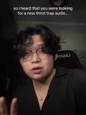 A selfie-style shot of a person in a dark shirt and glasses, looking towards the camera. White text overlay at the top.