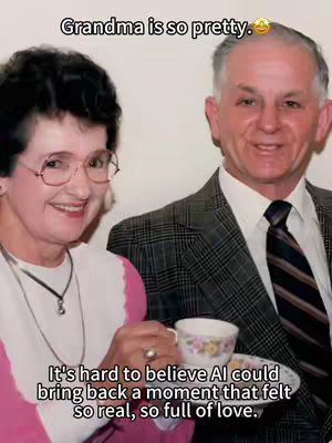 An old photograph comes to life with AI. The image shows an older woman in glasses smiling, with an older man with gray hair smiling next to her. They are both in a close embrace. Overlaid text provides context.