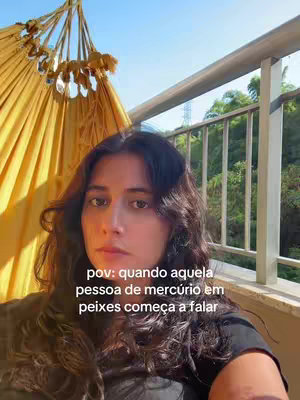 A woman with dark hair looks towards the camera. She is sitting under a yellow hammock, with a scenic background of trees and the sky. Text overlayed on image.