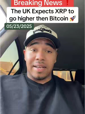 A man in a black shirt and a white and black baseball cap is inside a car, looking directly at the camera and speaking. Above his head is a red banner with the words "Breaking News!" and below a white banner with the text that reads, "The UK Expects XRP to go higher then Bitcoin" A rocket ship emoji is at the end of the sentence. The date "05/23/2025" appears below the text in a green box.