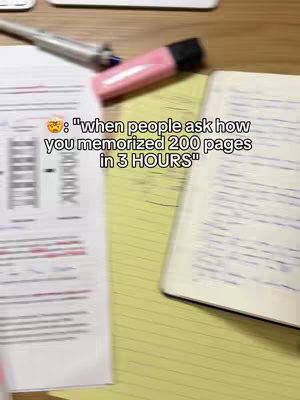 The cover image is a slightly blurred, top-down shot of a desk or table. On the left side, there's a sheet of lined paper with some text and lines visible, along with a part of a pen. The center features a yellow notepad with script. In the mid-ground, a pink highlighter rests on the table. The text overlay includes a surprised emoji and the quote "when people ask how you memorized 200 pages in 3 HOURS."