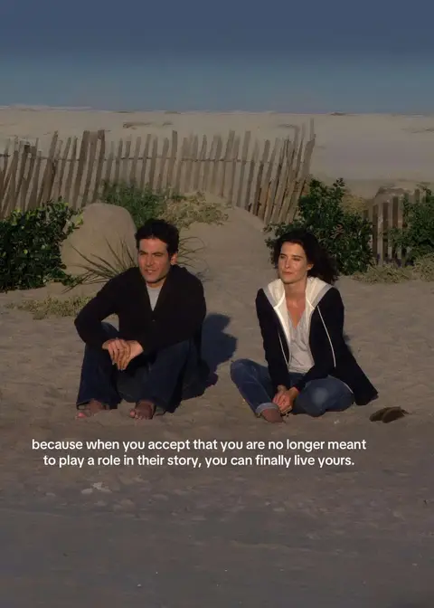 The image is a screenshot from the TV show "How I Met Your Mother." It shows Ted and Robin sitting together on a beach. They are both dressed casually, sitting on the sand near some green bushes and a wooden fence. Text overlay at the bottom of the screen provides the key theme of the video: letting go.