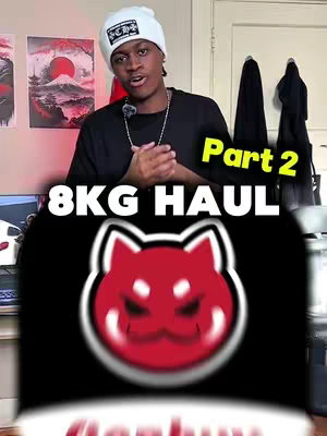 A man is posing in front of a camera, with a red and white setting on the background. There is a text overlay that reads '8KG HAUL - Part 2', and a red dog logo that partially covers up the man.