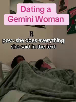 The image shows a close-up shot of a bed with two partially visible people under a blanket. Text overlays appear at the top, with a title 'Dating a Gemini Woman' and a caption 'pov: she does everything she said in the text'.