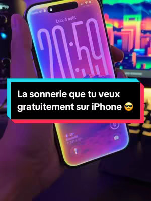 A person's hand holding an iPhone is showing the home screen. The phone screen displays a colorful background and a clock. The overlaid text is in a black box and reads, 'La sonnerie que tu veux  gratuitement sur iPhone'. The background is blurred with purple and blue colors.