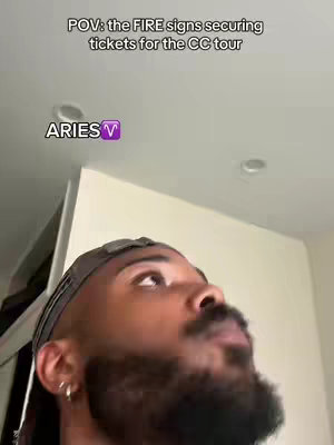 A man with a beard and a durag looks upward, with text overlays indicating a POV shot related to securing tickets for a tour and focusing on the Aries zodiac sign.