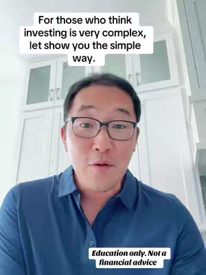 A medium shot shows an Asian male wearing glasses and a blue shirt, looking directly at the camera and speaking. Above him is a white text overlay with the video's hook. Below him is a text overlay with the disclaimer. The background is of a white kitchen.