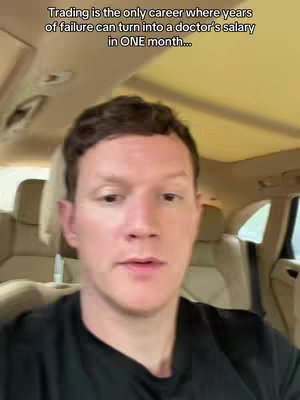 Interior shot of a car, with the creator's face filling most of the frame, set against a blur of beige seats and a tan-colored roof, illuminated by soft, natural light. The primary focus is the creator, who is centered, with a neutral expression, wearing a black shirt. Above, text overlays in a clean white font highlight the video’s hook.