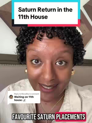 A selfie-style shot featuring a woman in a light-colored top, facing the camera with a slight smile. She has short, curly black hair. Behind her is a lightly patterned wall and a bright header with text that indicates the video content's main subject. Two text call-outs rest atop and below the subject's face.