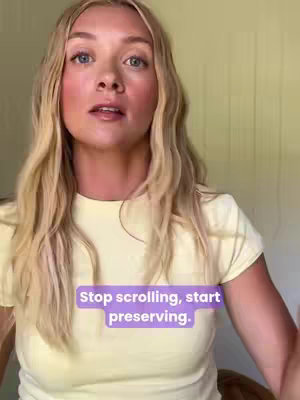 A young woman with long blonde hair is in a well-lit room, wearing a yellow t-shirt. She has fair skin and is looking upwards, with a purple text overlay that reads, Stop scrolling, start preserving.