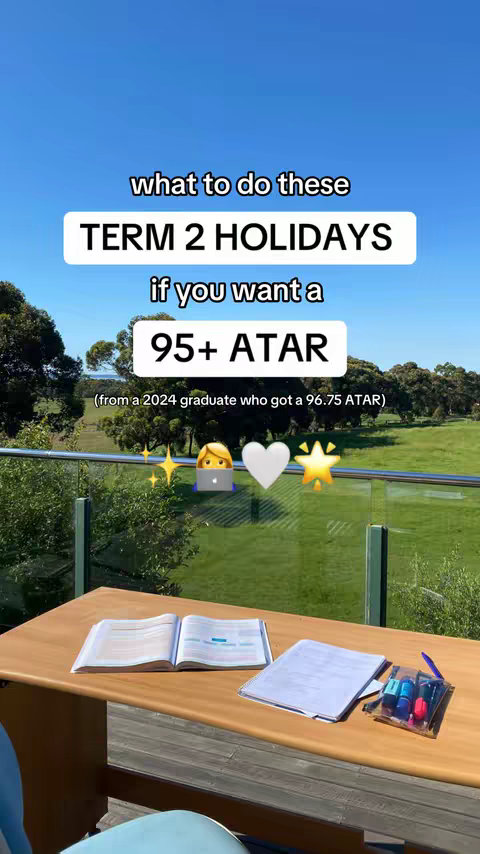 The cover image showcases a sunny outdoor scene with a wooden table in the foreground. On the table are textbooks, notebooks and a pen case. The background features a glass balcony with a view of green fields and trees under a bright blue sky. Text overlays and emojis are added to the image for context.
