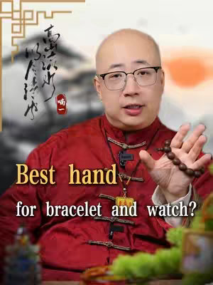 A man in a red jacket with glasses holds a bracelet. The image is a medium shot and the background includes a stylized drawing.