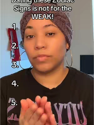 A woman with a head wrap and large hoop earrings looks directly forward. The image has overlaid text and numbers along the side. The composition is a medium close-up shot, with the woman's face being the primary focus. The background is blurred, suggesting a shallow depth of field.
