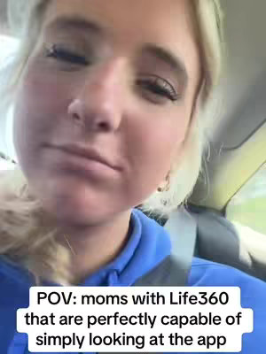 A selfie-style shot from inside a car featuring a young blonde woman. The woman, with a neutral expression, is positioned off-center to the left, and the background reveals a glimpse of the outdoors through the car window. Text overlays the bottom of the frame, providing context about the scene.