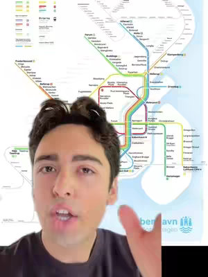 The cover image showcases a man against a backdrop of a colorful map. The map, with a white background, features multicolored lines representing a transportation system, possibly a subway or train network. Station names are visible with colored lines, which adds to the artistic design. The layout is organized, but the complexity suggests a large geographical area. The man is positioned in the foreground, he is speaking and gesturing with his right hand.