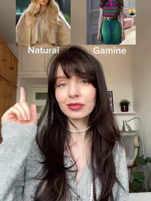 A woman points upwards with her right index finger, set against a background with two fashion style images: one of a woman wearing a neutral-colored outfit and the other of a woman modeling a colorful top and skirt. The frame is filled with the creator's face, with the words "Natural" and "Gamine" labeling each style image.