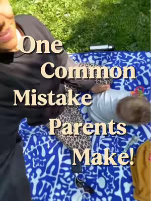 A woman and a baby are laying on a blue and white blanket on green grass.  The words 'One Common Mistake Parents Make!' are overlayed in white text.