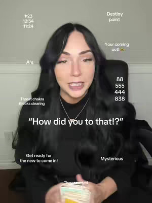 A woman with long black hair is centered in the frame, smiling and speaking. Text overlays are scattered around her head, including time stamps, numbers, and phrases. The background is simple, with a neutral wall evident just behind the woman.