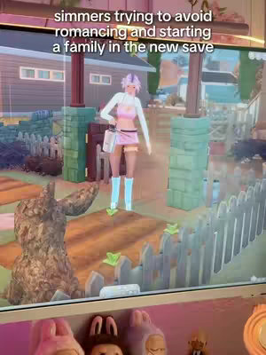 The image shows a scene from The Sims 4. A female character, styled with pink hair and a matching outfit, stands in a virtual garden setting. Text overlay at the top reads, "simmers trying to avoid romancing and starting a family in the new save."