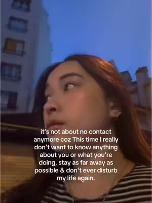 The cover image shows a young woman looking off to the side with buildings and a blue sky in the background. There is overlaid text in white at the bottom of the image.