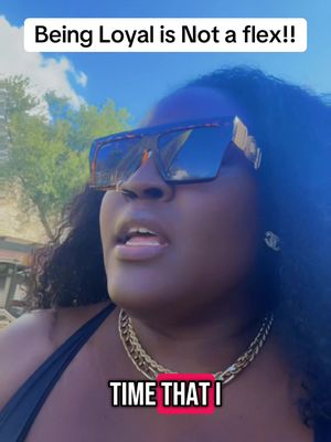 A selfie-style video cover image shows a Black woman with dark hair and oversized sunglasses. She wears a gold necklace and a black top. Text overlays are placed at the top and bottom of the image.