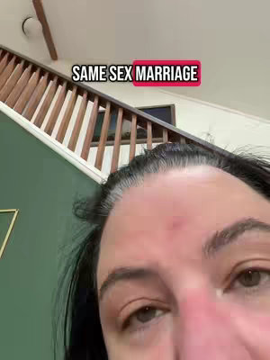 A close-up shot of a person's face, with a focus on their eyes. The upper part of a staircase, painted white with wooden handrails, is visible in the background. A text overlay at the top reads 'SAME SEX MARRIAGE' in a bold, white font with a red outline.