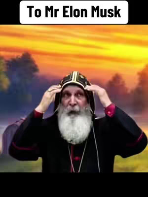 The image is a vertical selfie of an older man wearing a religious headdress and black robes. The man has a long white beard and is looking towards the camera with a neutral expression. He has both hands raised with fingers touching the cap above his head. The background is blurred, showing a sunset with orange and yellow hues.
